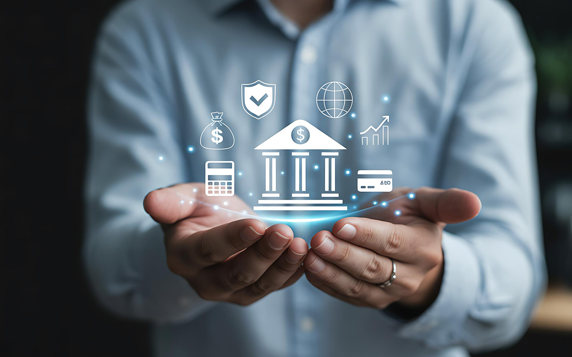 Businessman holding holographic banking and finance icons in his hands