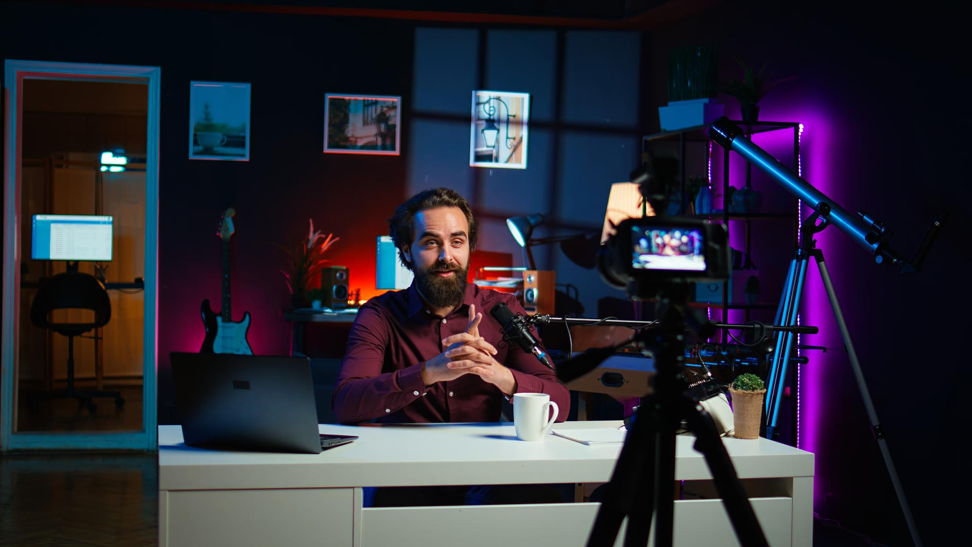 Content creator recording a video in a studio with camera and ring light